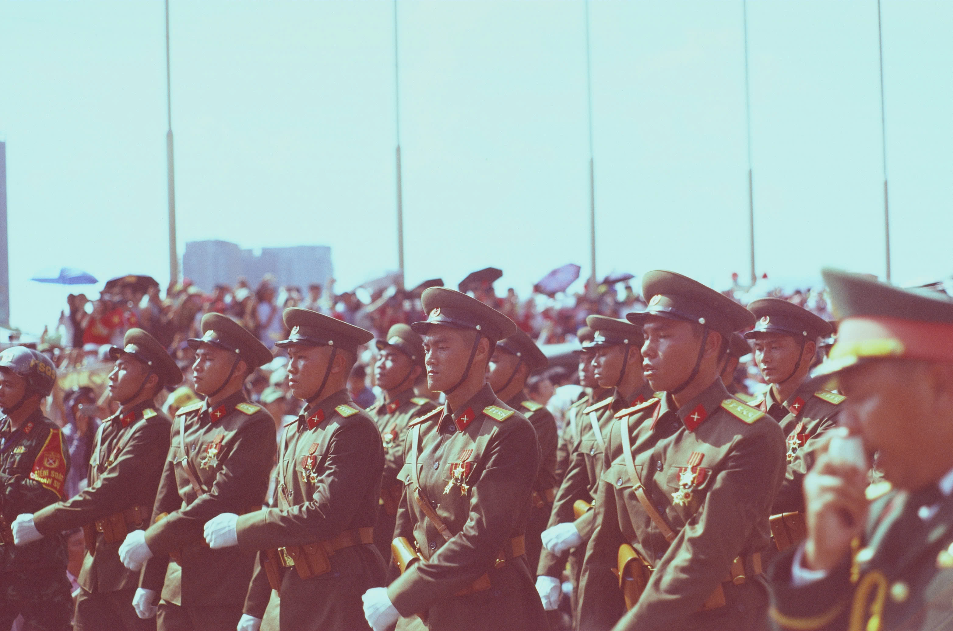 A formation of Vietnamese soldiers marching during the daytime rehearsal